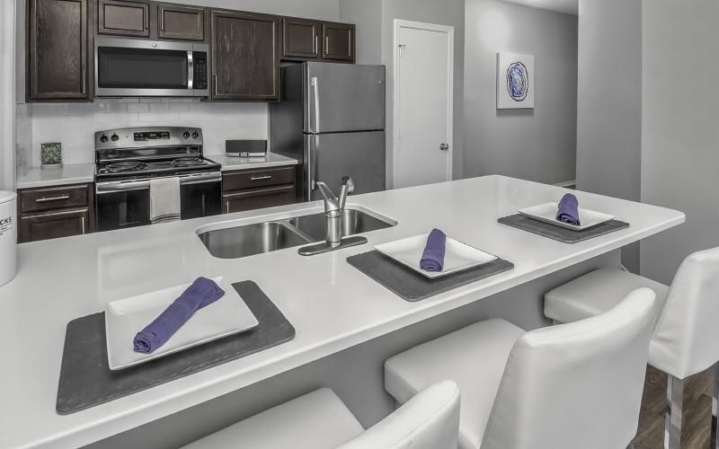 a kitchen with a table and chairs